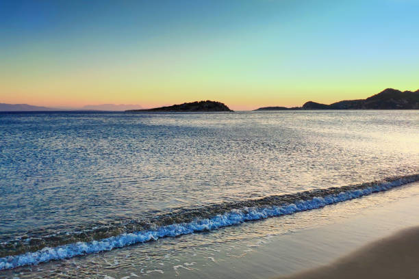 istock Sea at sunset. Summer evening on an island in Greece. Selective focus. 1183605357