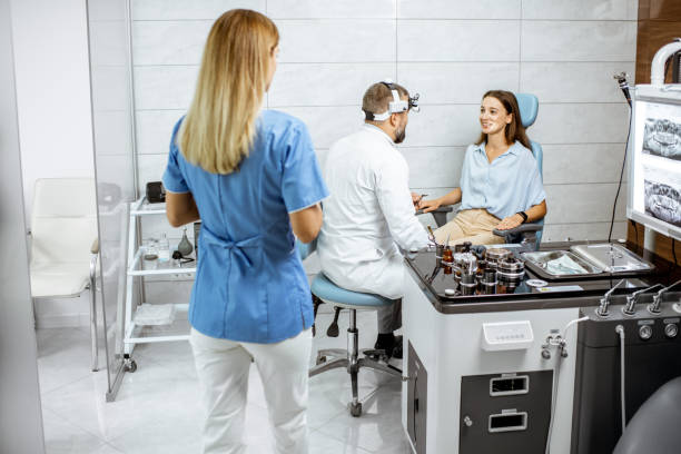 istock Otolaryngologists examining young patient in ENT office 1183605400