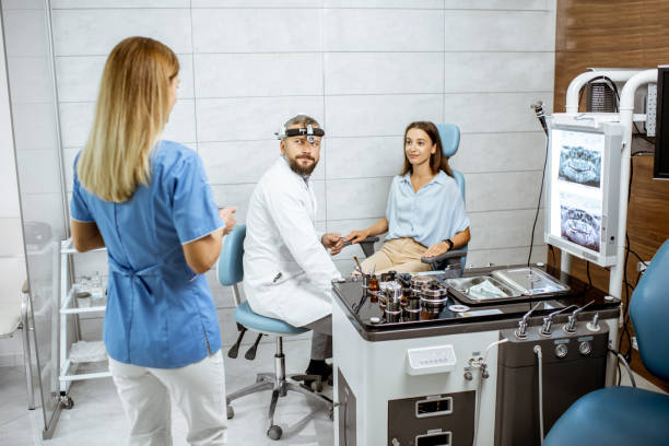 istock Otolaryngologists examining young patient in ENT office 1183605401