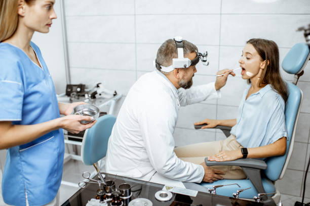 istock Otolaryngologists examining young patient in ENT office 1183605434