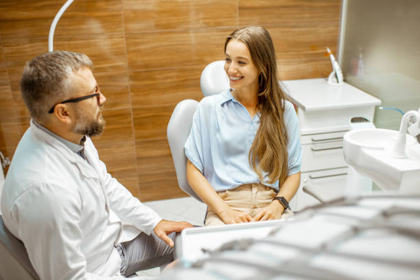istock Young patient with dentist having a medical consultation 1183607229