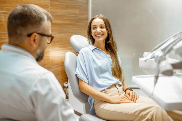 istock Young patient with dentist having a medical consultation 1183607273
