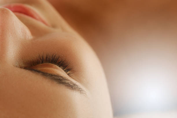 natural eyebrow and eyelashes with mascara of dark skinned female