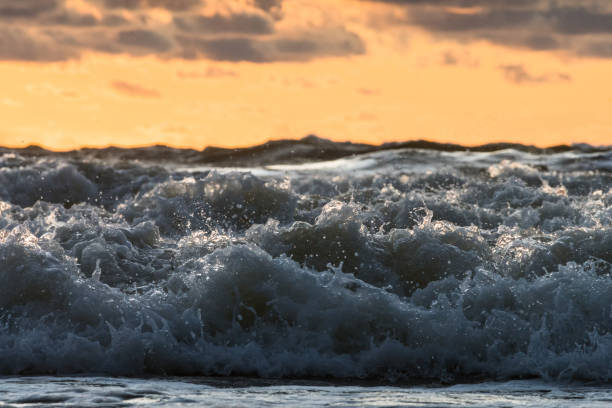 Closeup of the high waves of Baltic sea in autumn whilst the sun is setting