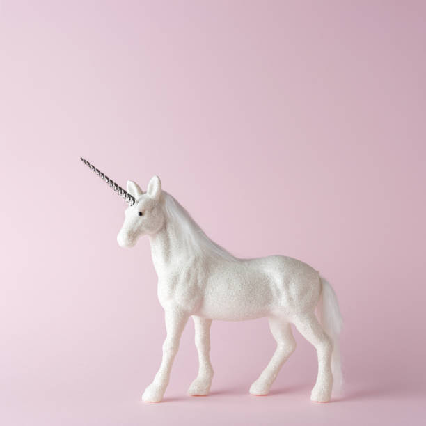istock Creative composition with glitter unicorn on pink background. Minimal holiday concept. 1183611821
