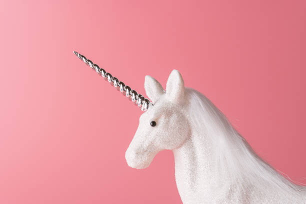 istock Creative composition with glitter unicorn on pink background. Minimal holiday concept. 1183611830
