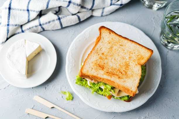 istock Chicken Brie cheese sandwich on the plate 1183612429