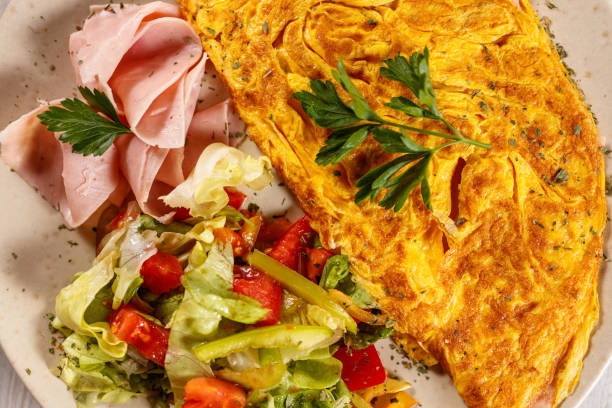 istock Omelette with ham and fresh salad 1183615501
