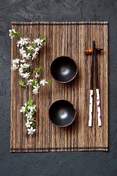 istock Oriental tablesetting with cherry branch, top view 1183615663