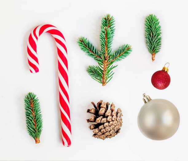 istock Flat lay Christmas composition  with pine tree branches, Christmas Candy and Santa cookie  on white background.  Top view 1183616243