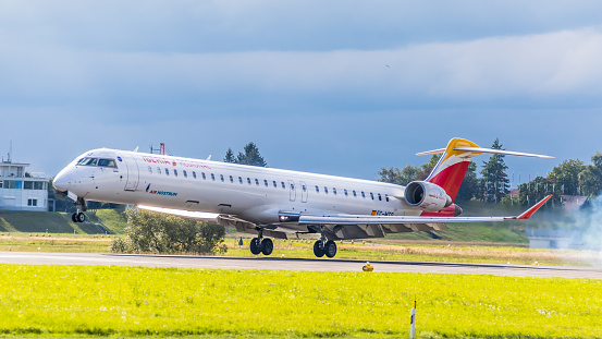 Zurich, Switzerland - August 15, 2019: A Canadair Regional Jet CRJ-1000 of Air Nostrum lands at Zurich Airport. The aircraft with registration EC-MTO has been in operation since January 2018 and is operationally active for the Spanish airline Iberia.