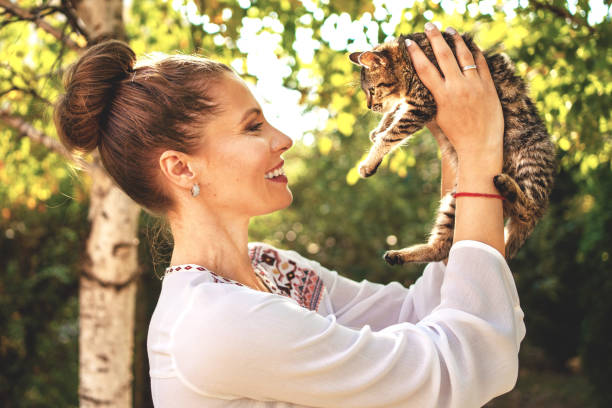 istock Woman with cat at back yard 1183620503