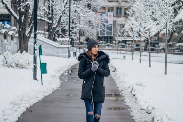istock Pretty woman walking in park 1183621232