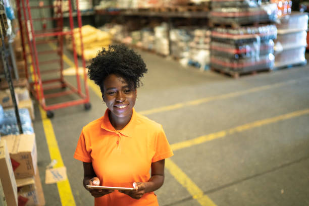 istock Portrait of young worker using digital tablet at warehouse 1183627334