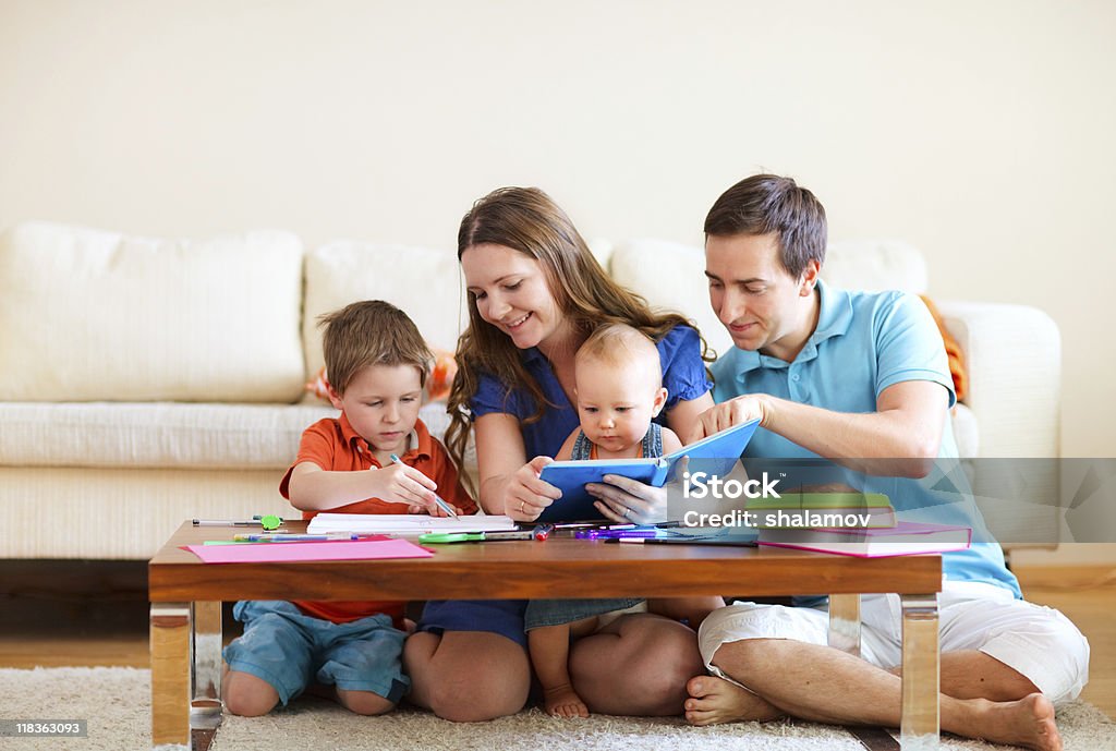 Family drawing and reading  Adult Stock Photo