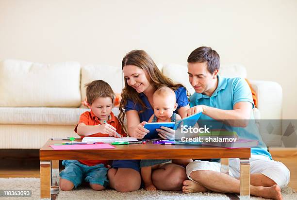 Family Drawing And Reading Stock Photo - Download Image Now - Adult, Baby - Human Age, Baby Girls