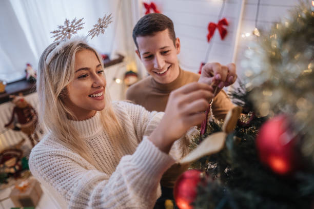 istock Couple decorating their home during new year's eve 1183631833