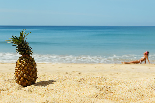 Pineapple fruit  on the beach at sunny day