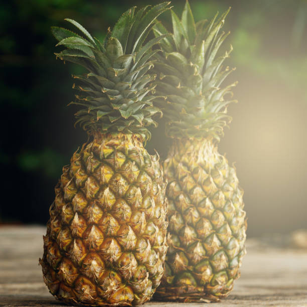 istock Pineapple fruits on wooden surface 1183636372