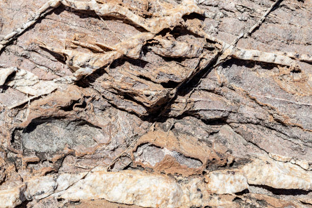 istock Natural rock surface with white crystal lines. Can be used as background. 1183643287