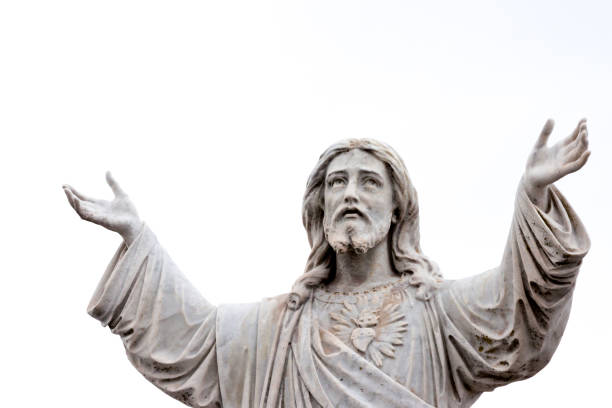 istock Old staue of Jesus Christ, sky background with copy space 1183644859