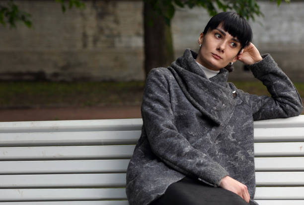 istock Bored, lonely girl on a Park bench 1183651043
