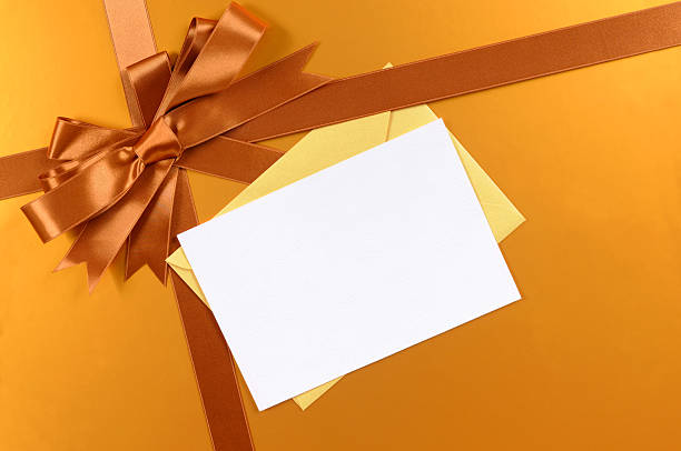 istock Gold gift with blank greetings card 118365300