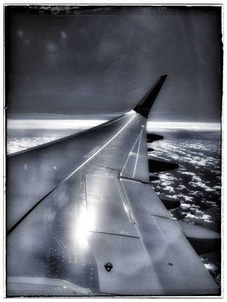 Over wing view Air travel Airline Airbus 321 Black and white stock photo