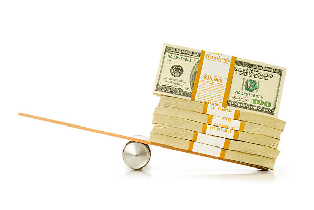 Hand with a dumbbell and cash on a white background.