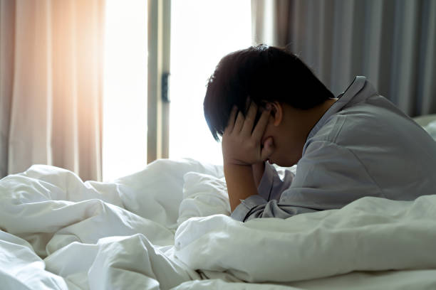 little boy feels a headache in the morning. - little boys child sadness depression imagens e fotografias de stock