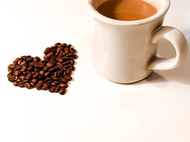 istock Cup Of Coffee With Heart Shaped Coffee Beans 1183670962