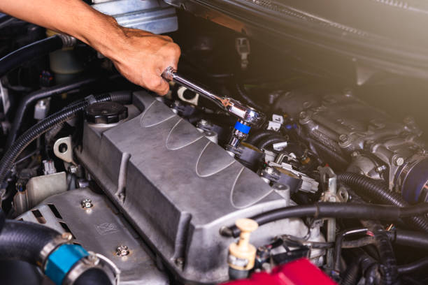 istock Hand of auto mechanic technician service engine and using wrench socket repairing car 1183672658