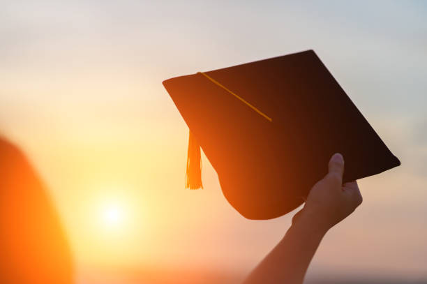 istock Graduates wear a black hat to stand for congratulations on graduation 1183672861