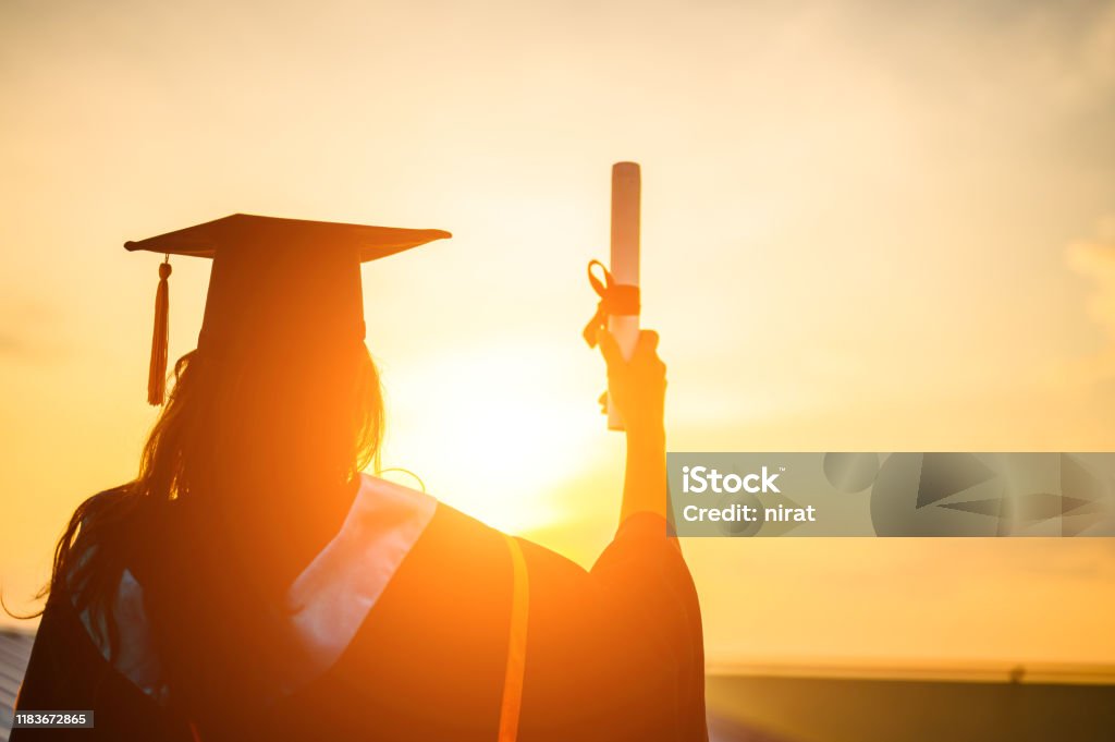 Graduates wear a black hat to stand for congratulations on graduation Graduation Stock Photo