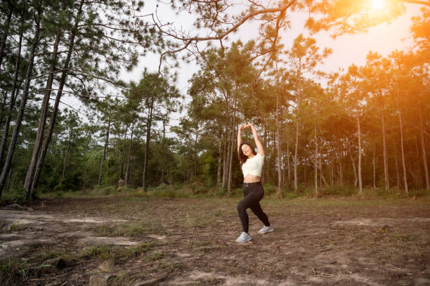 istock A woman running trek at a mountain pine forest. 1183672872