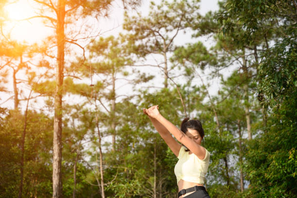 istock A woman running trek at a mountain pine forest. 1183672905