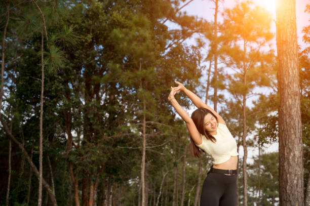 istock A woman running trek at a mountain pine forest. 1183672927
