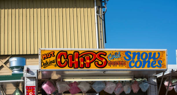 istock fairground boardings above a portable shop. 1183673606