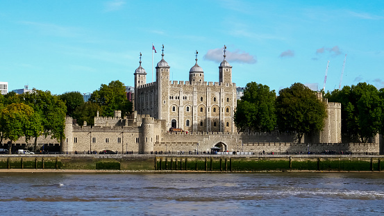 London, United Kingdom - May 30, 2023:  People waiting in a row for the entrance to the famous Tower of London.