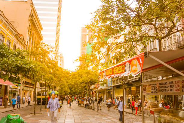 Rio de Janeiro, Brazil - September 20, 2018: General view of Rio de Janeiro's Downtown at sunset afternoon. People walking through the streets.