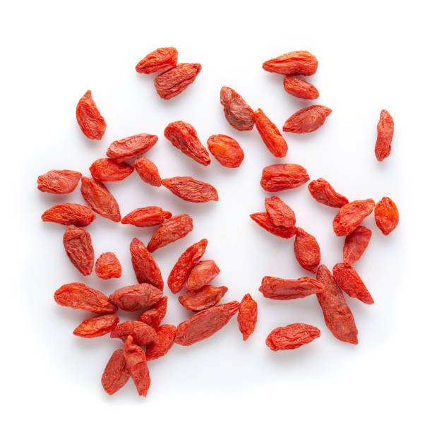 istock Wolfberry or Dried Goji berries isolated over white background. 1183692337