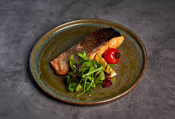 istock juicy fish steak on a plate 1183692466
