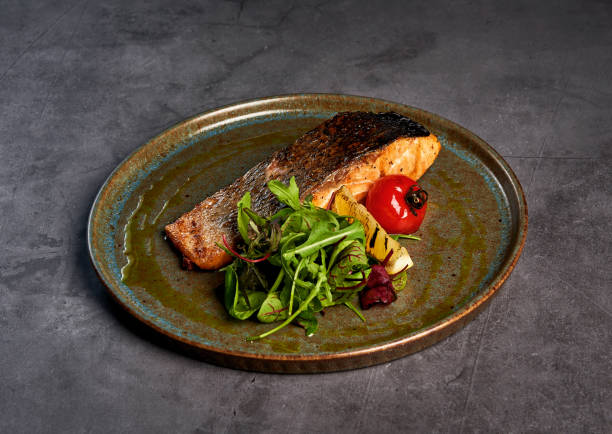 istock juicy fish steak on a plate 1183692987