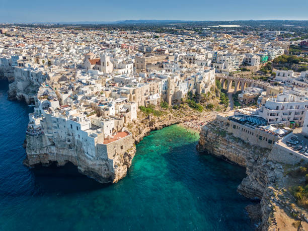 Polignano A Mare, Apulia, Italy Aerial view of Polignano a Mare town and beach in Bari Province, Puglia, Italy bari photos stock pictures, royalty-free photos & images