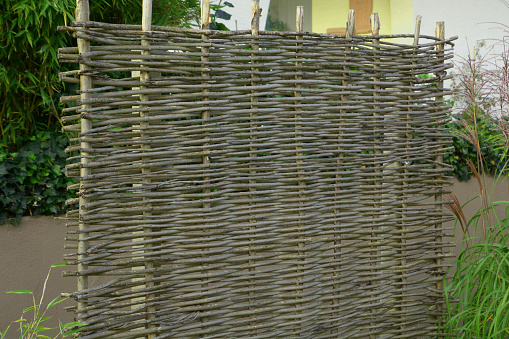 wicker fence as a natural garden decoration