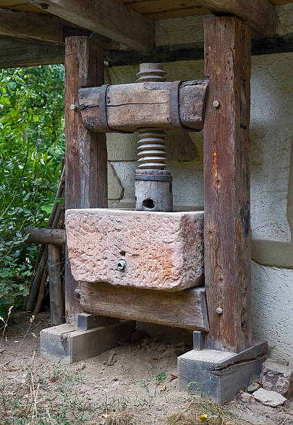 a historic pressin front of a old Black Forest House (Southern Germany)