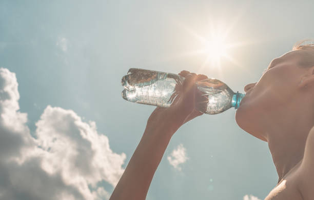 istock Woman drinking water 1183702141