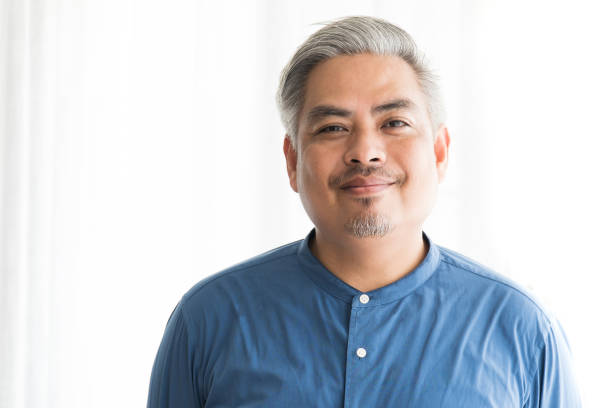 istock Asian Business Man Smiling on White Background 1183704555