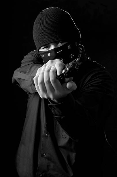 istock Criminal with a Gun in Black & White 118370762