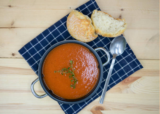 istock tasty tomato soup in closeup. 1183708189